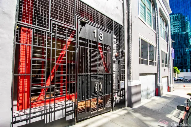 a view of a garage with rack and bicycle