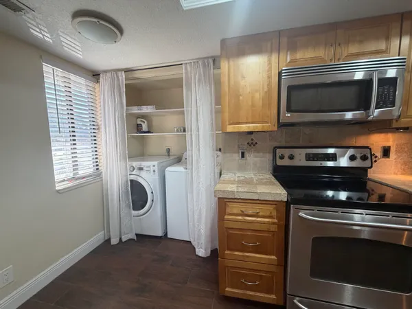 a kitchen with a stove and a microwave