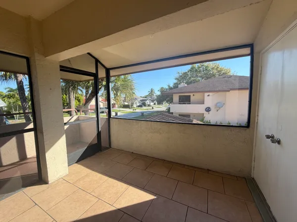 a view of kitchen with furniture and large window