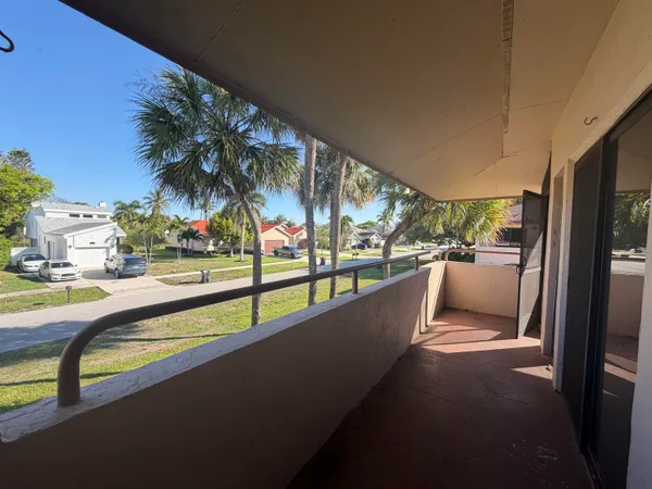 a view of a swimming pool with a porch