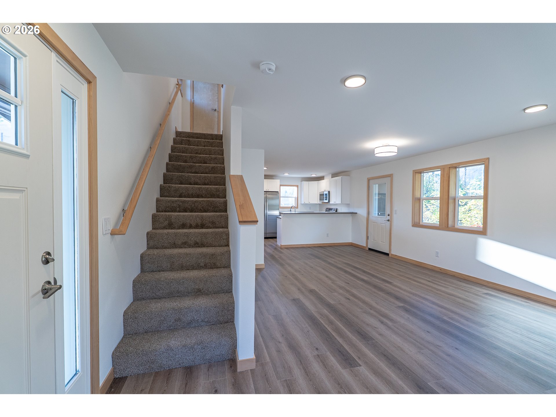 51680 Rose Street Blue River, OR 97413 - Photo 11 of 17 a view of empty room with wooden floor and windows