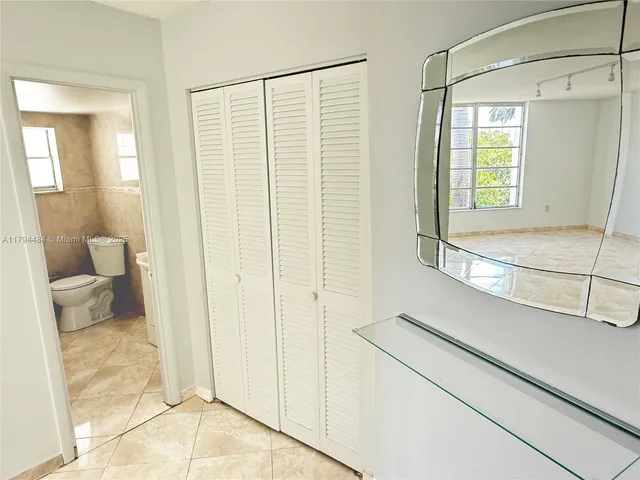 a bathroom with a shower and a toilet