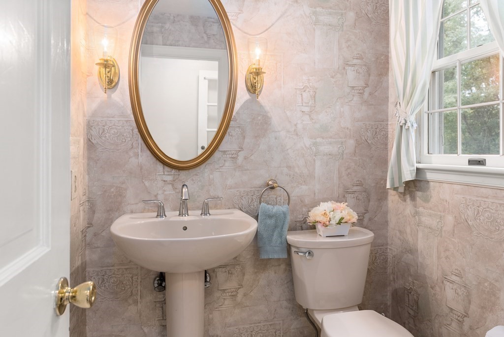 4 Standish Drive Canton, MA 02021 - Photo 18 of 32 a bathroom with a toilet sink and mirror