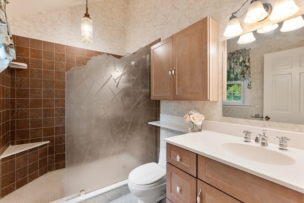 4 Standish Drive Canton, MA 02021 - Photo 21 of 32 a bathroom with a sink a toilet and shower