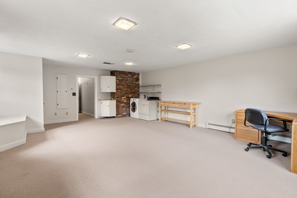 4 Standish Drive Canton, MA 02021 - Photo 27 of 32 a view of a livingroom with furniture and a kitchen