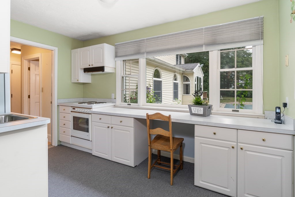 4 Standish Drive Canton, MA 02021 - Photo 28 of 32 a kitchen with white cabinets and white appliances