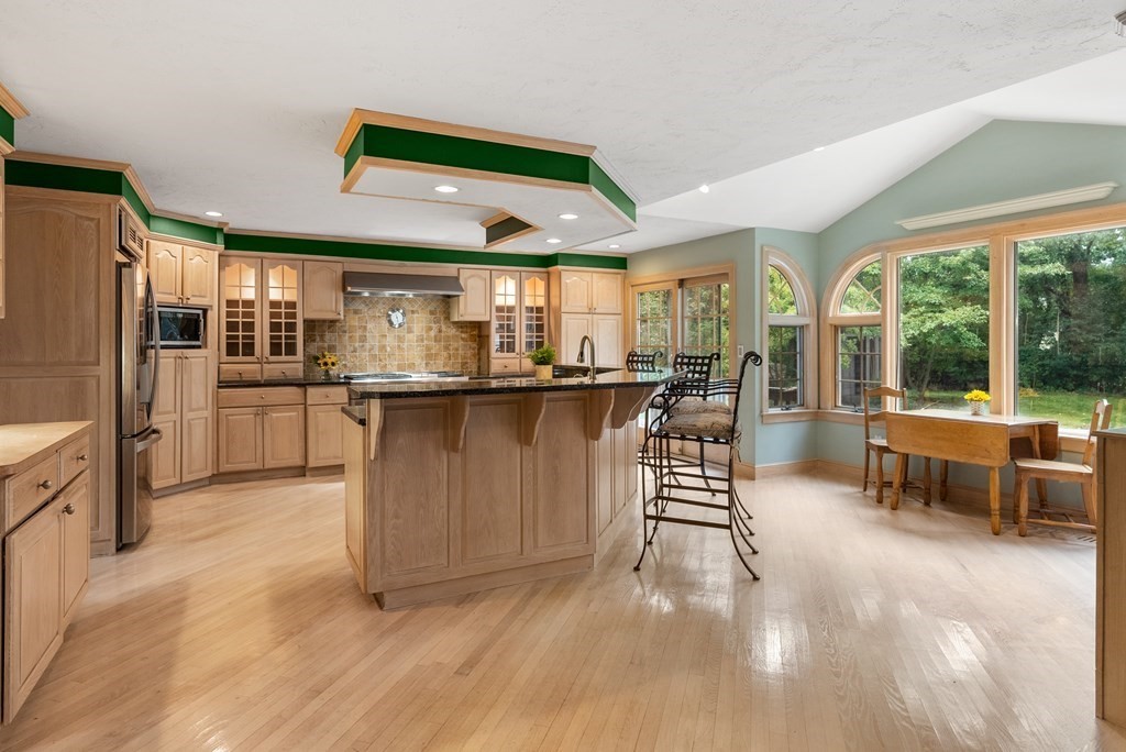4 Standish Drive Canton, MA 02021 - Photo 7 of 32 an open kitchen with granite countertop a large counter top space a sink stainless steel appliances and cabinets