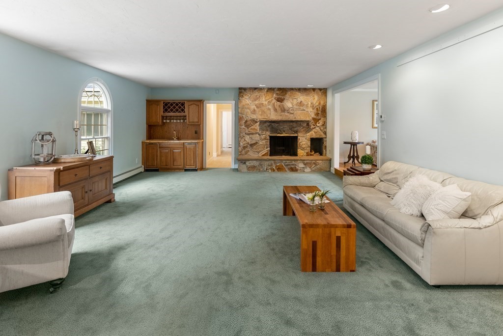 4 Standish Drive Canton, MA 02021 - Photo 9 of 32 a living room with furniture and a fireplace