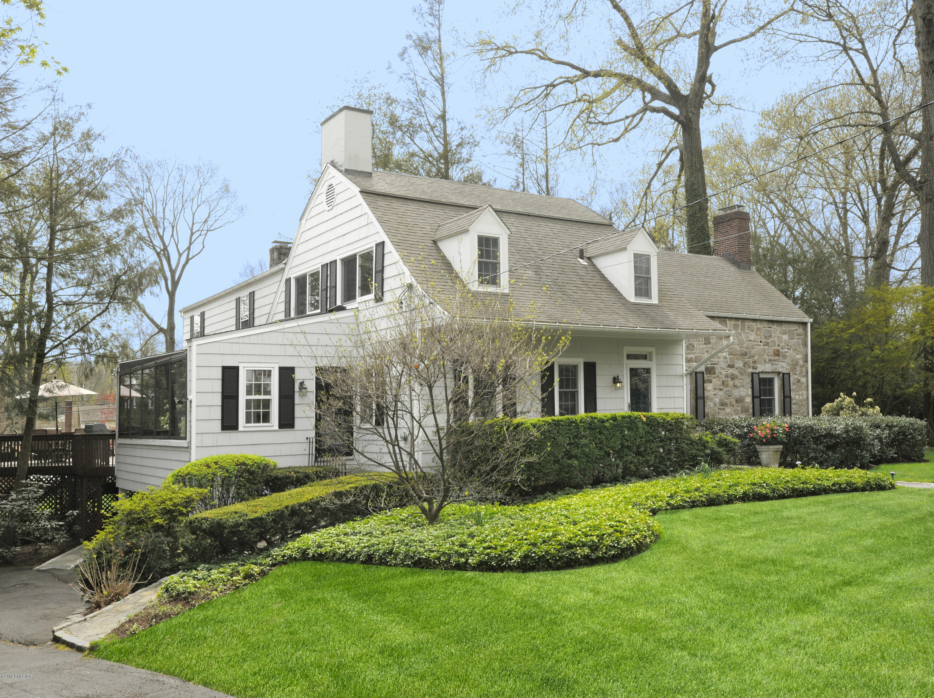 12 Wesskum Wood Road Riverside, CT 06878 - Photo 1 of 41 a front view of a house with a yard and trees