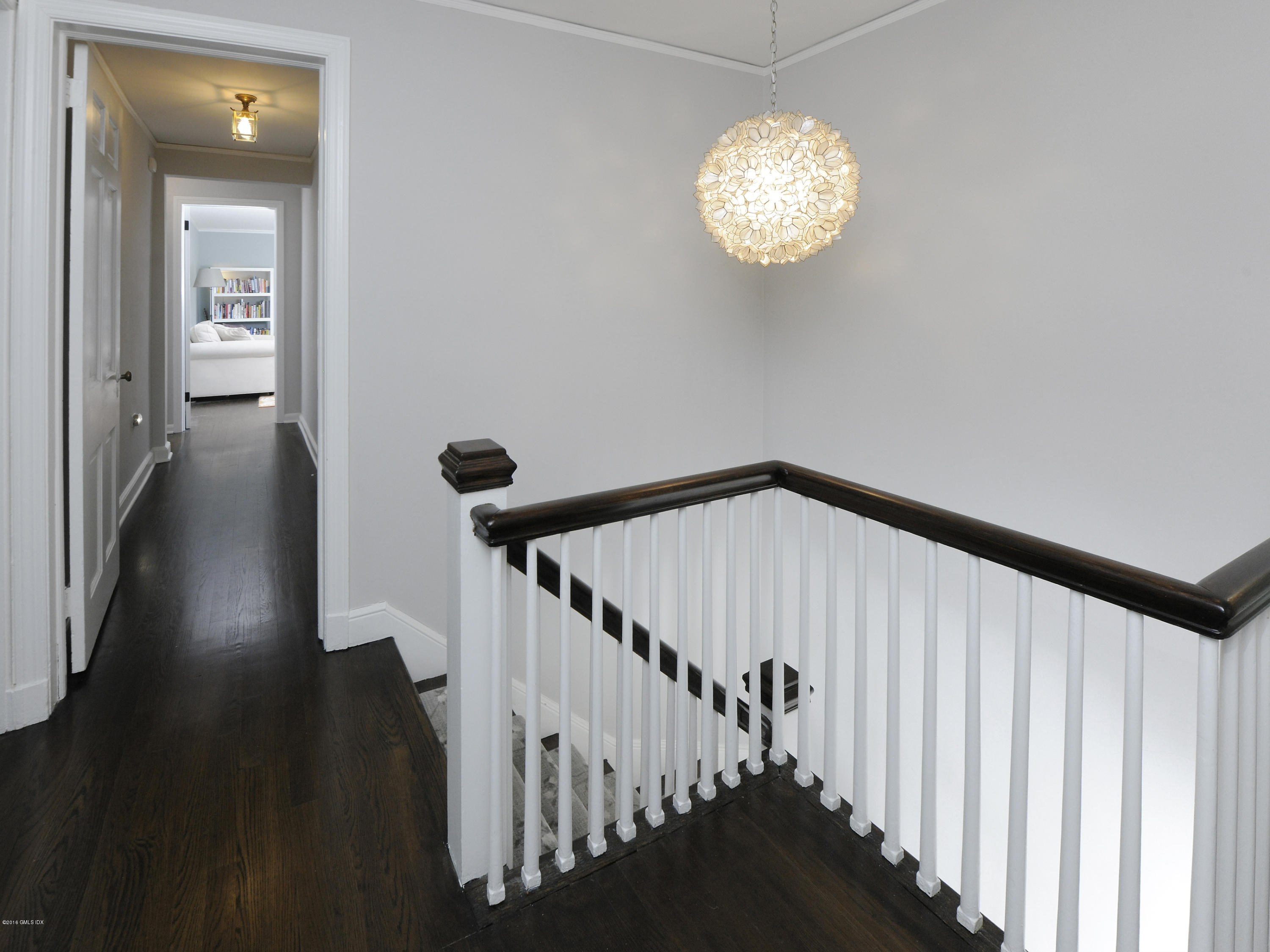 12 Wesskum Wood Road Riverside, CT 06878 - Photo 17 of 41 a view of a hallway with wooden floor and staircase