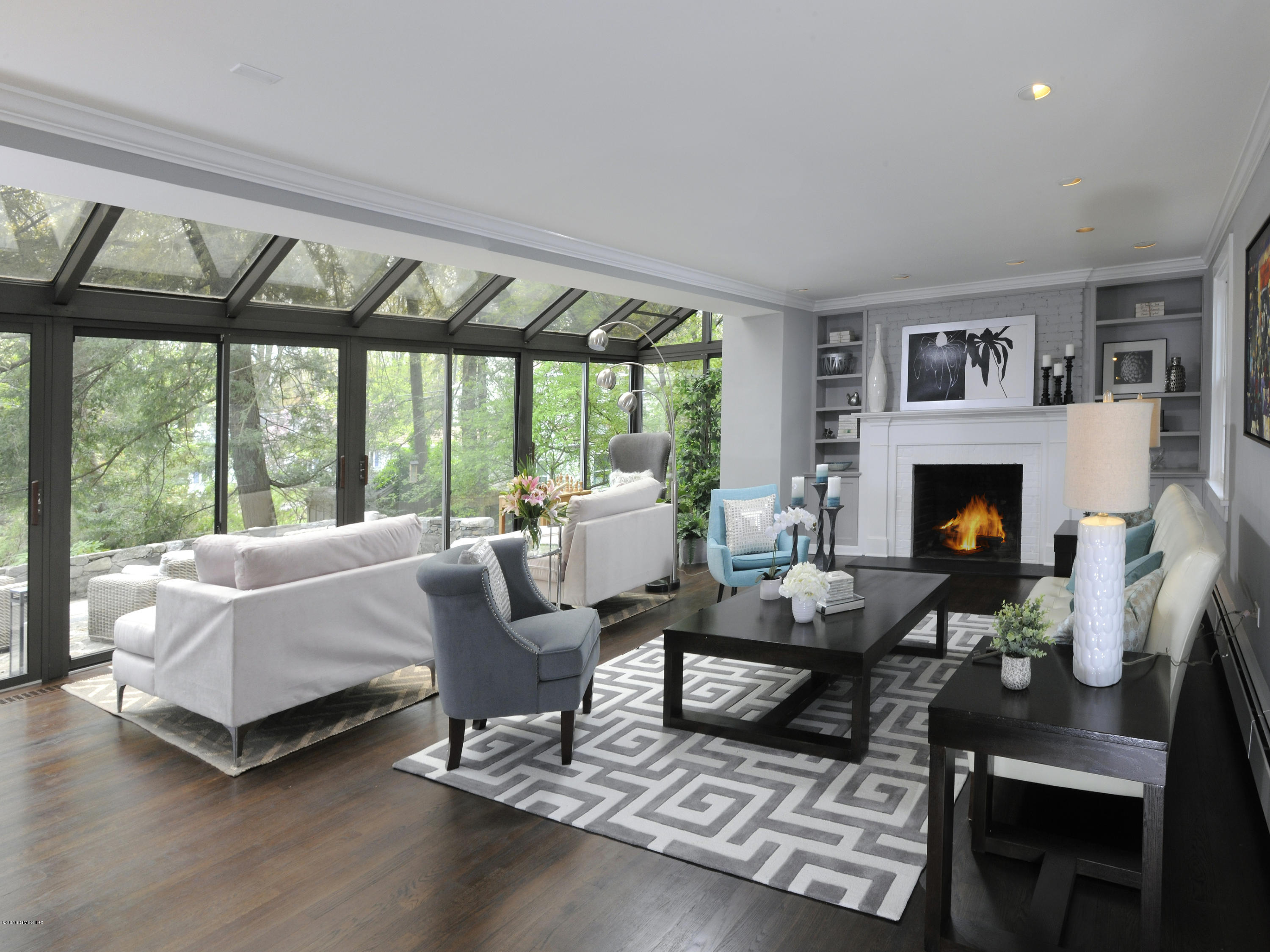 12 Wesskum Wood Road Riverside, CT 06878 - Photo 5 of 41 a living room with furniture fireplace and a large window