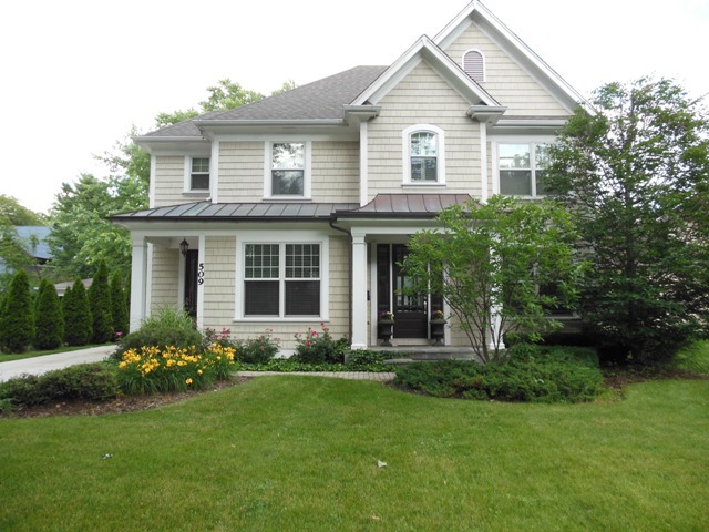 509 Phillippa Street Hinsdale, IL 60521 - Photo 1 of 20 a front view of a house with a yard and porch
