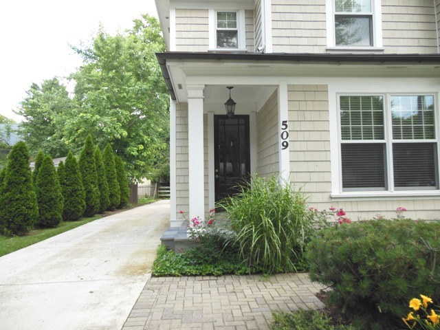 509 Phillippa Street Hinsdale, IL 60521 - Photo 3 of 20 a front view of a house with a yard