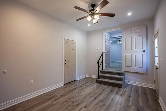 wooden floor in an empty room with a fireplace
