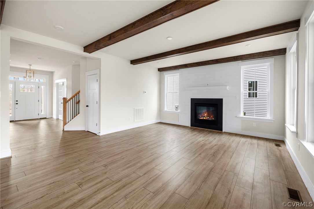 15142 Heaton Drive Midlothian, VA 23112 - Photo 16 of 41 a view of empty room with wooden floor and fireplace