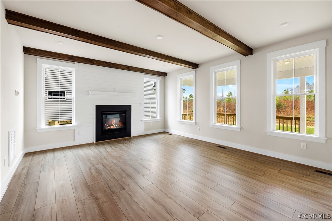 15142 Heaton Drive Midlothian, VA 23112 - Photo 17 of 41 a view of an empty room with wooden floor and a window