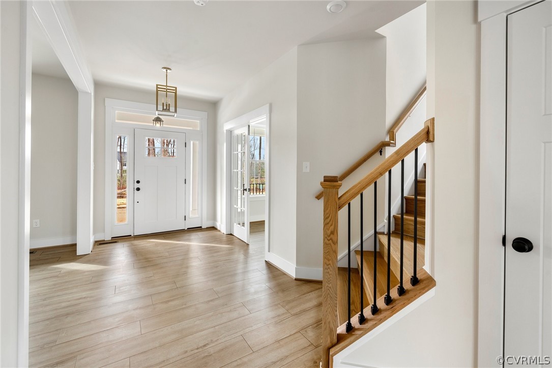 15142 Heaton Drive Midlothian, VA 23112 - Photo 18 of 41 a view of a hallway with wooden floor and staircase