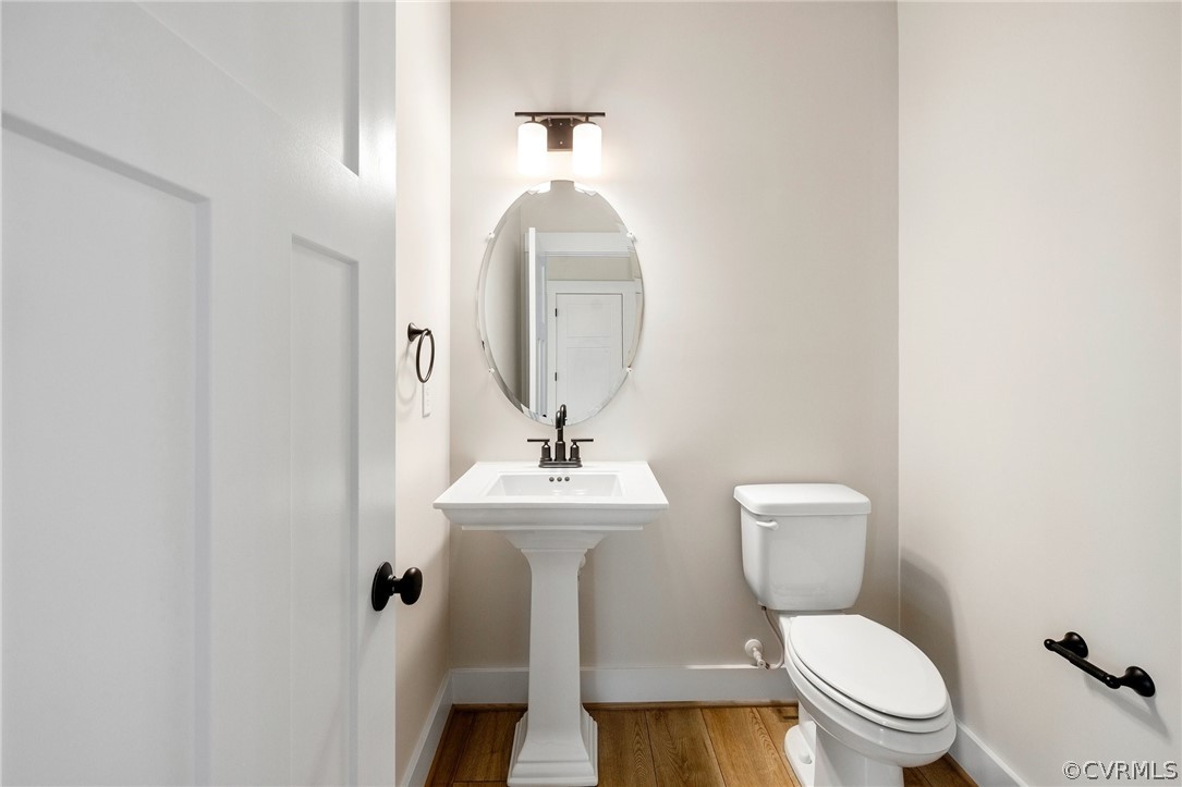 15142 Heaton Drive Midlothian, VA 23112 - Photo 20 of 41 a white toilet sitting next to a bathroom sink