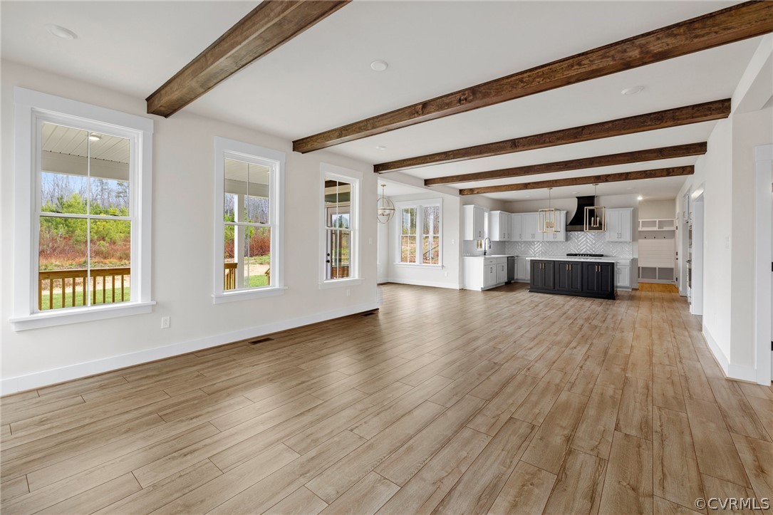 15142 Heaton Drive Midlothian, VA 23112 - Photo 21 of 41 a view of empty room with wooden floor and windows