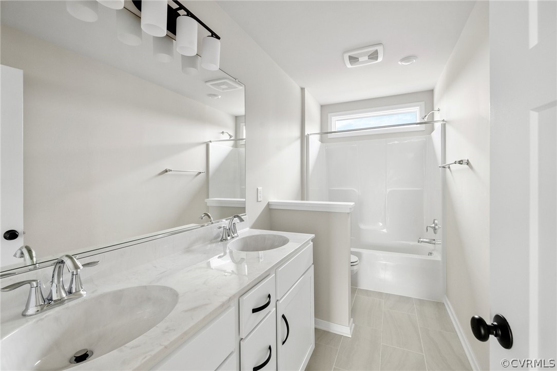 15142 Heaton Drive Midlothian, VA 23112 - Photo 25 of 41 a bathroom with a granite countertop sink a toilet and a mirror