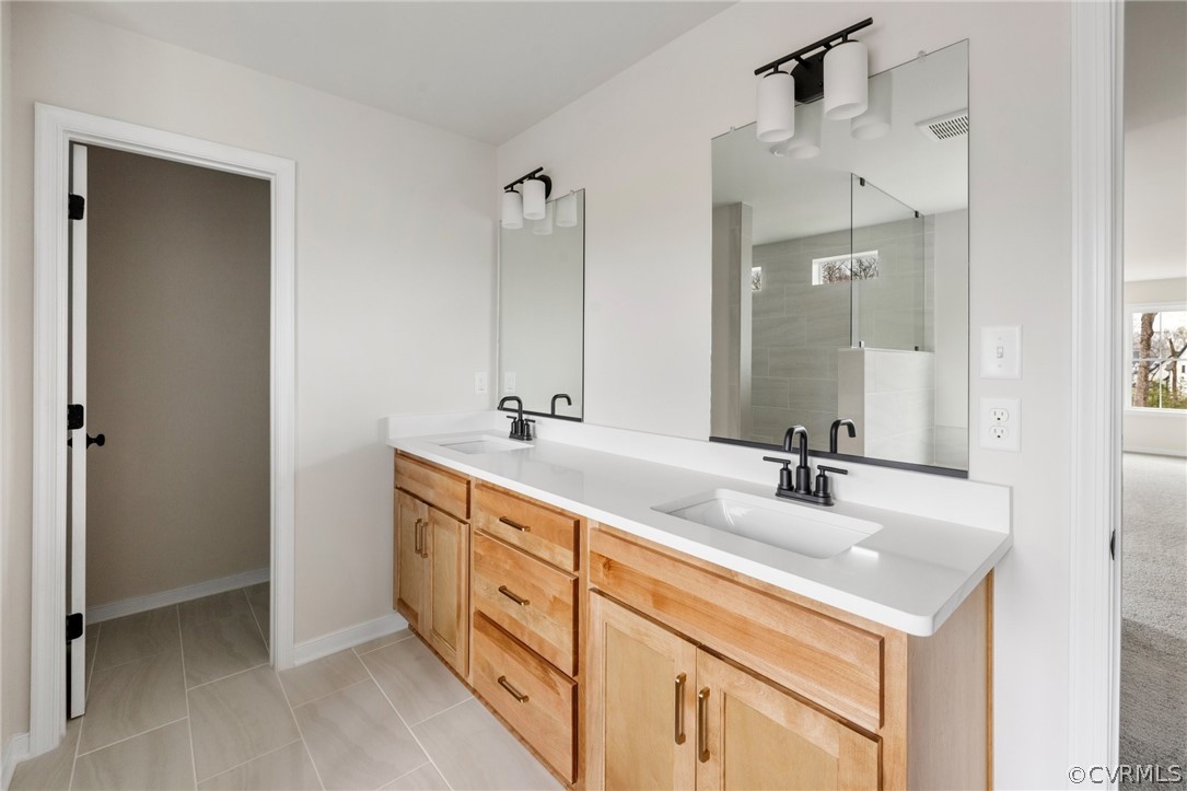 15142 Heaton Drive Midlothian, VA 23112 - Photo 31 of 41 a bathroom with a double vanity sink and mirror