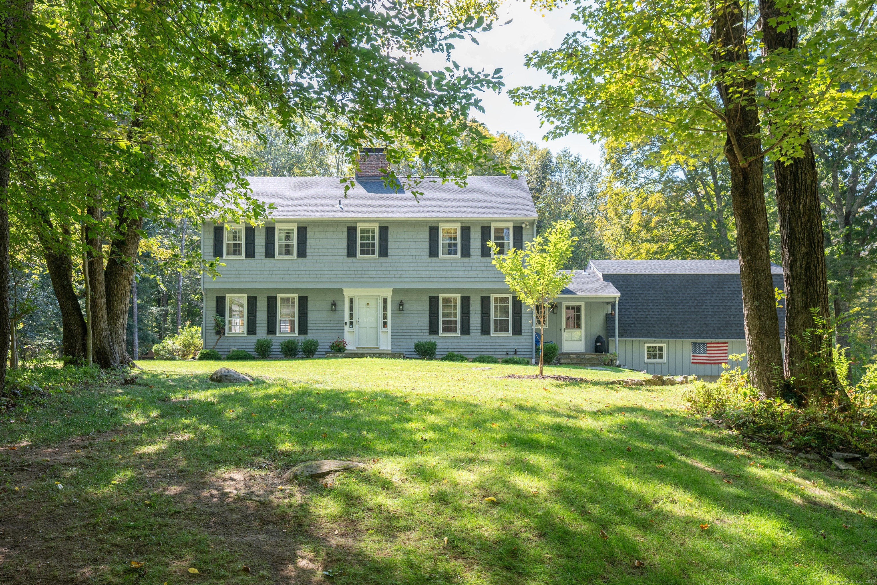 7 Barkwood Hill Road Brookfield, CT 06804 - Photo 1 of 1 a front view of a house with a yard