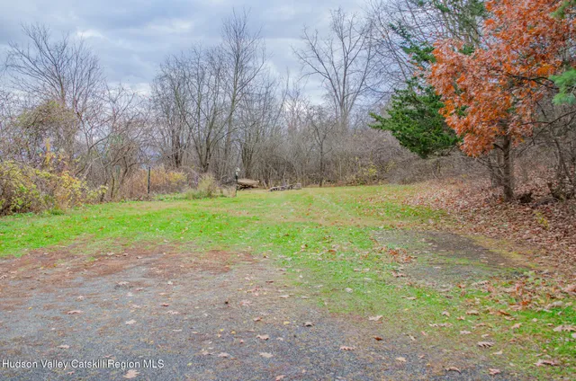 swimming pool view with a seating space