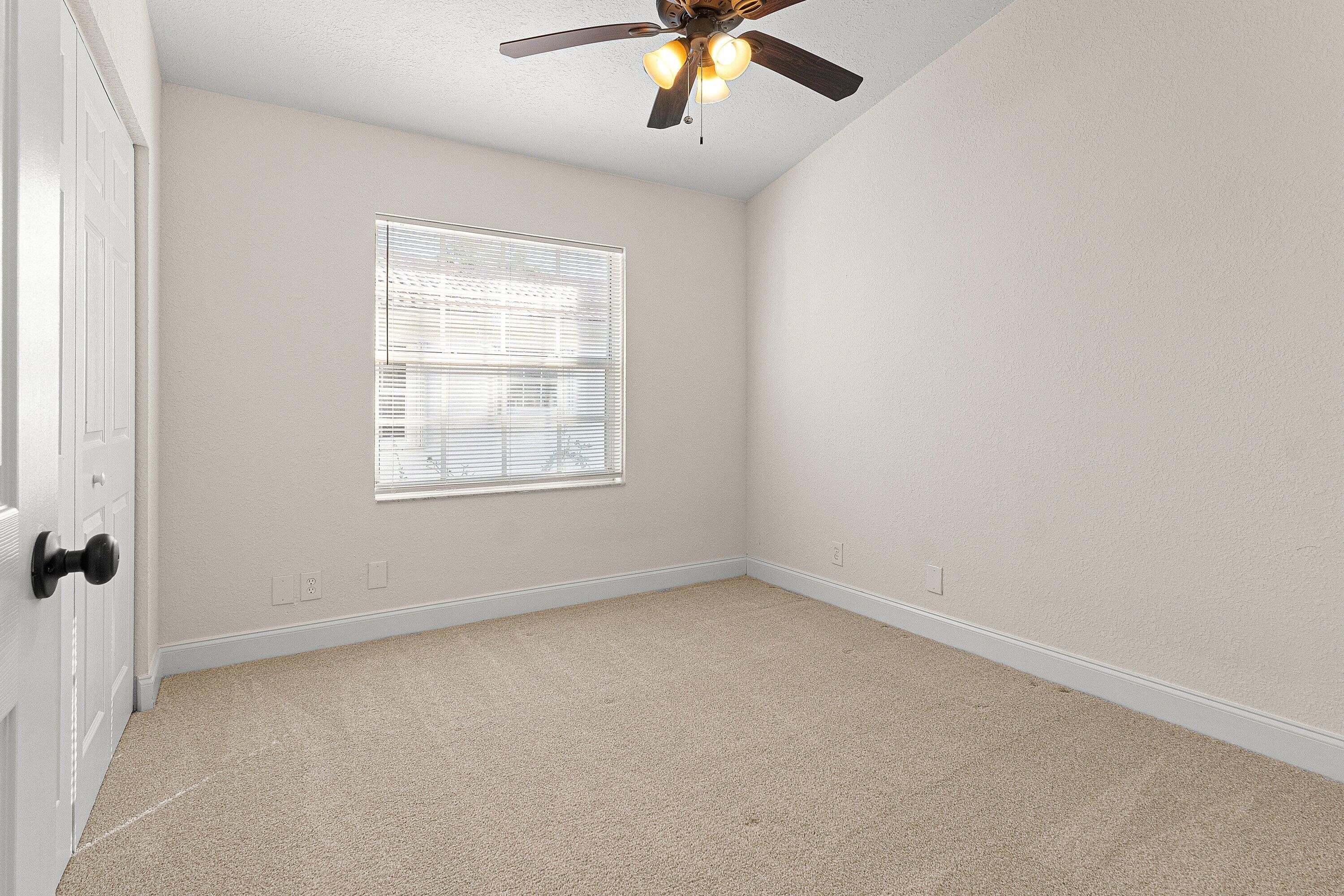 6081 Heliconia Road Delray Beach, FL 33484 - Photo 12 of 39 an empty room with a window