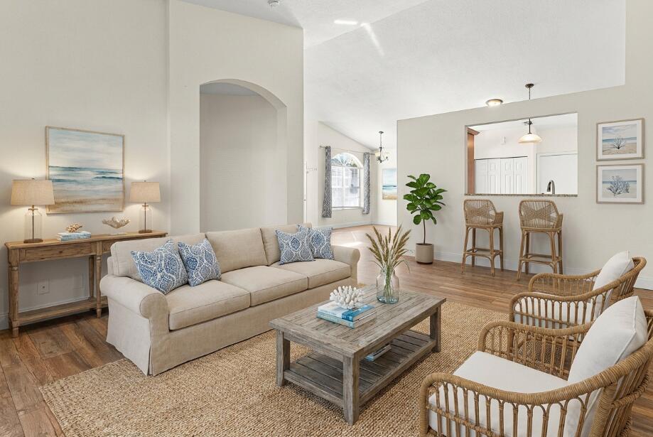 6081 Heliconia Road Delray Beach, FL 33484 - Photo 17 of 39 a living room with furniture a rug and a window