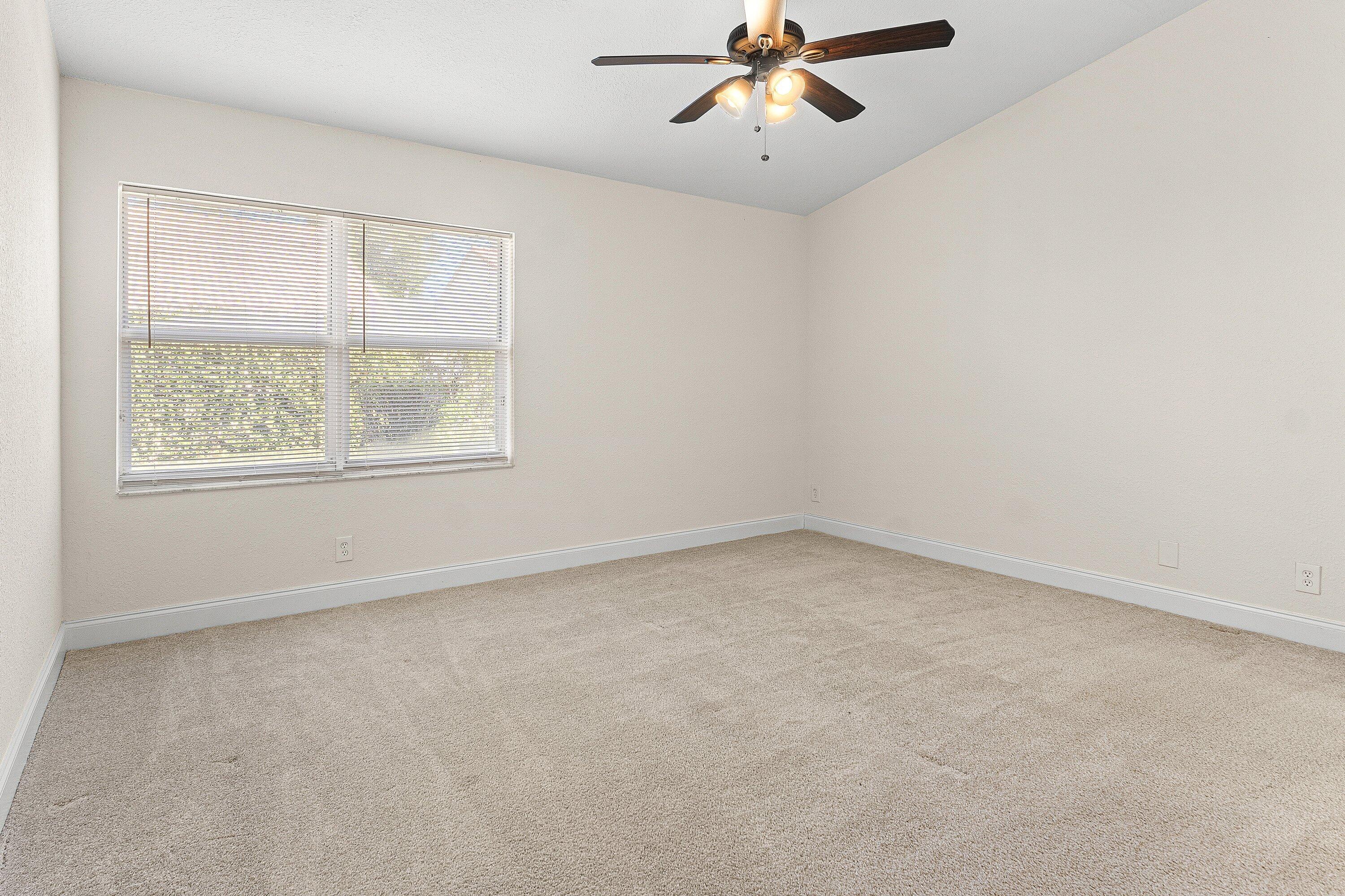 6081 Heliconia Road Delray Beach, FL 33484 - Photo 19 of 39 an empty room with a window