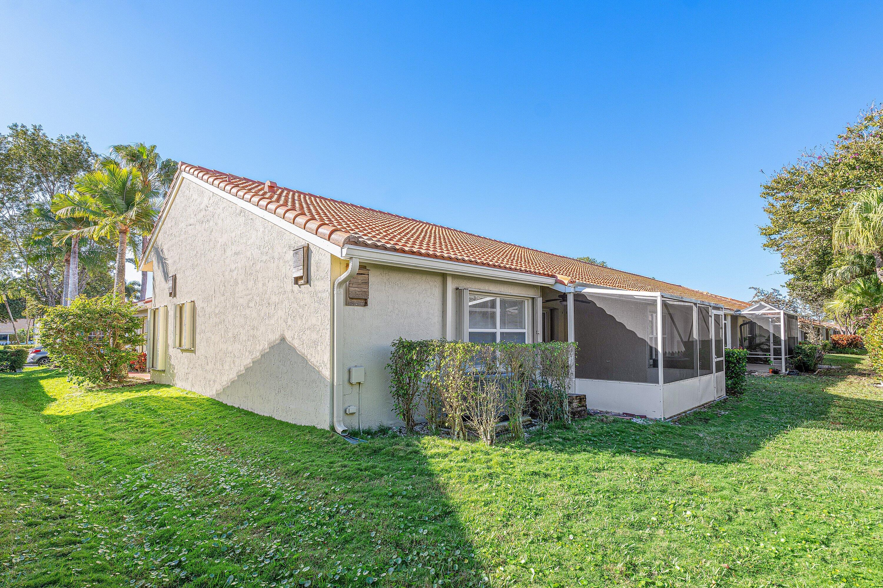 6081 Heliconia Road Delray Beach, FL 33484 - Photo 28 of 39 a view of a house with backyard