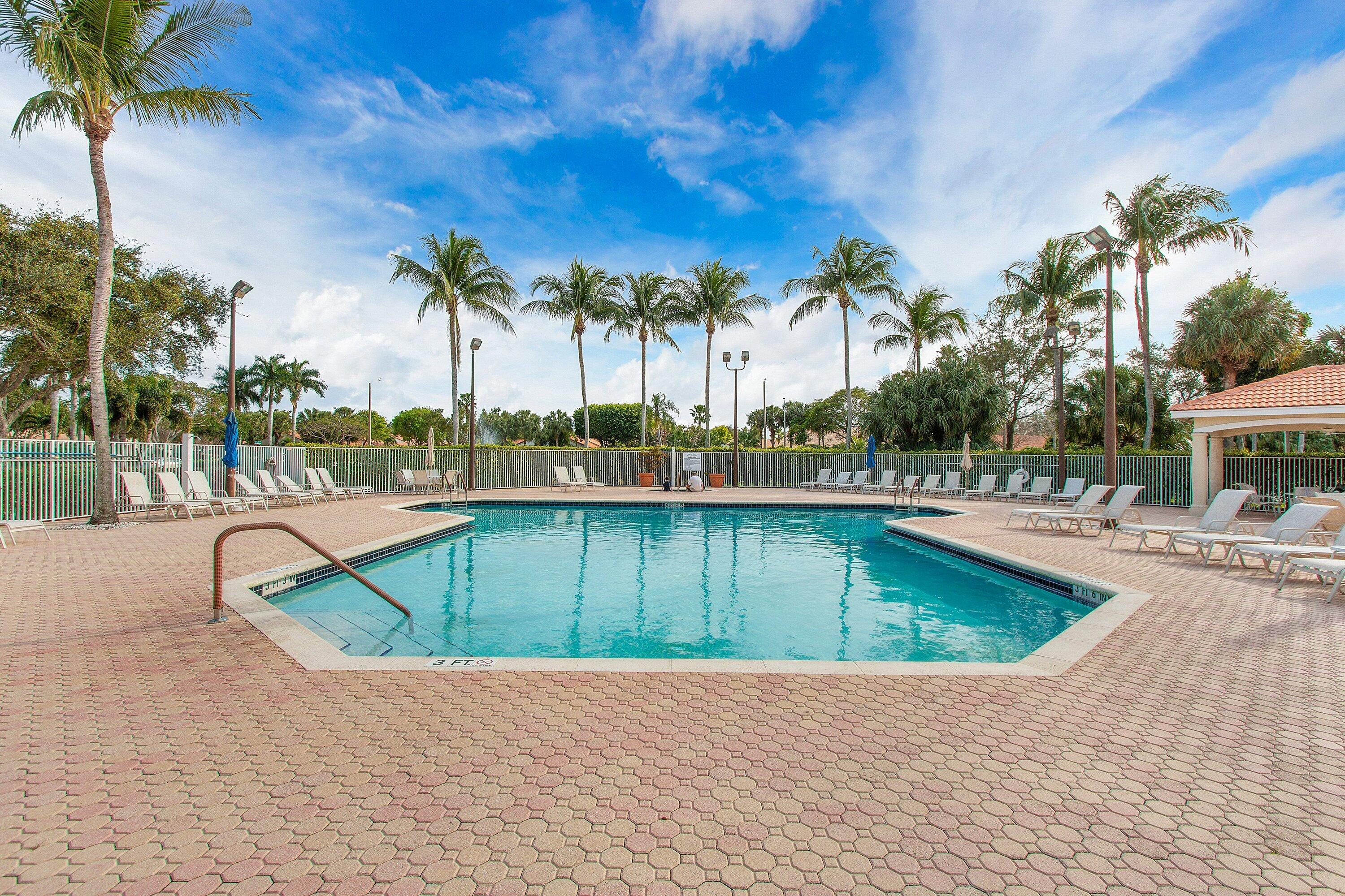 6081 Heliconia Road Delray Beach, FL 33484 - Photo 35 of 39 a view of a swimming pool with a patio