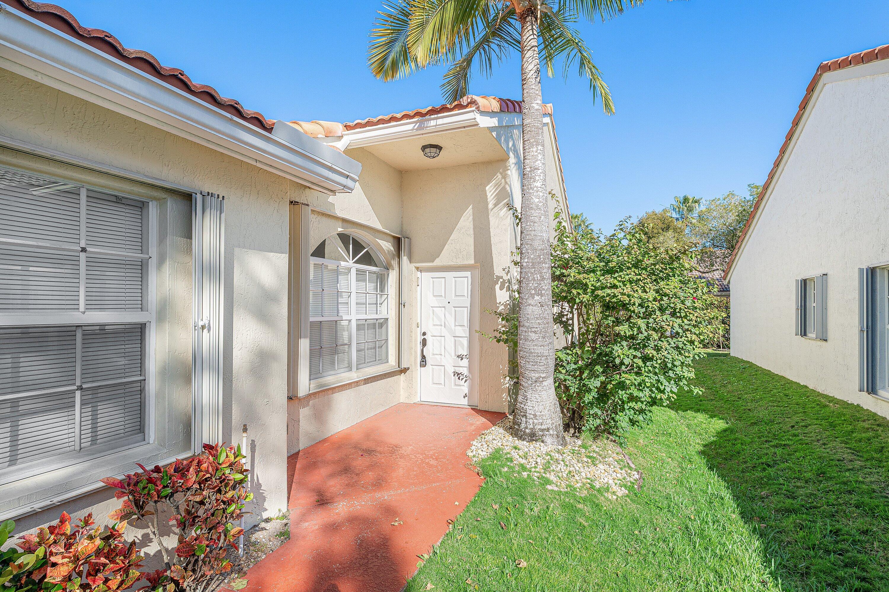 6081 Heliconia Road Delray Beach, FL 33484 - Photo 4 of 39 a view of a back yard of the house