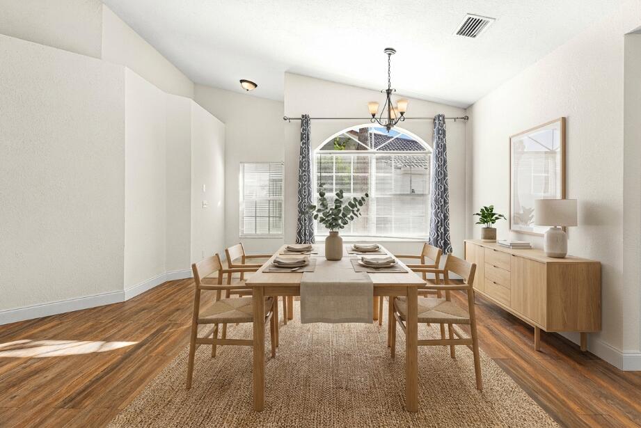 6081 Heliconia Road Delray Beach, FL 33484 - Photo 8 of 39 a view of a dining room with furniture window and outside view