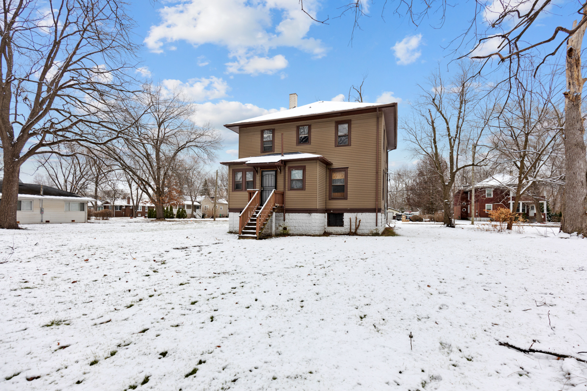 16746 Lincoln Street Hazel Crest, IL 60429 - Photo 19 of 20 a front view of a house with a yard covered in snow