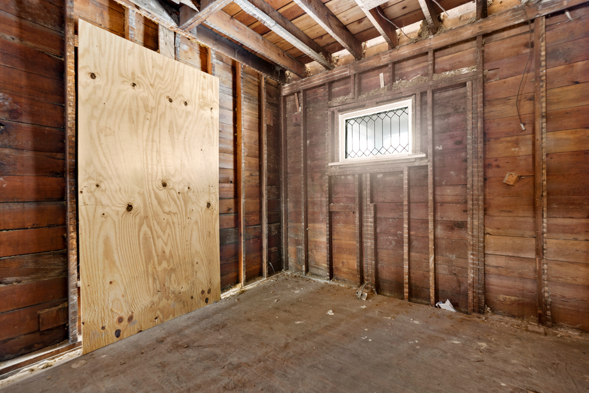 16746 Lincoln Street Hazel Crest, IL 60429 - Photo 5 of 20 a view of a hallway with wooden walls
