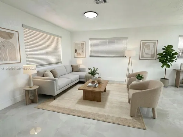 a living room with furniture and a large window