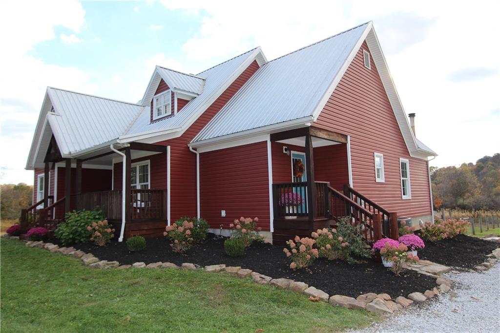 169 Wilpen Road Ligonier, PA 15658 - Photo 2 of 49 a view of a house with a yard