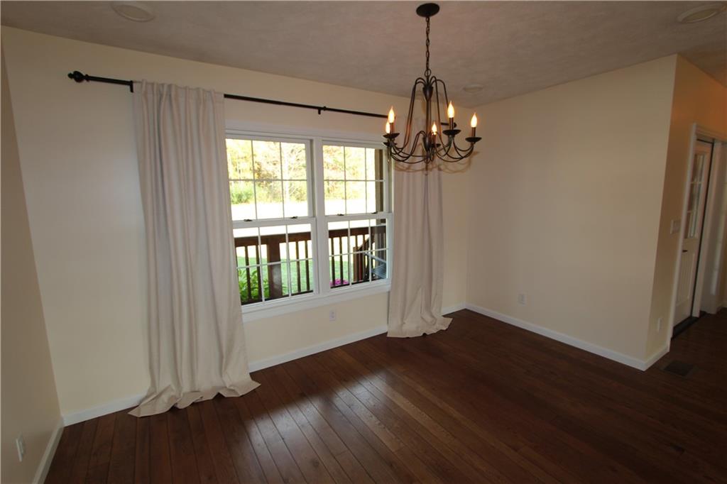 169 Wilpen Road Ligonier, PA 15658 - Photo 21 of 49 a view of an empty room with wooden floor and a window