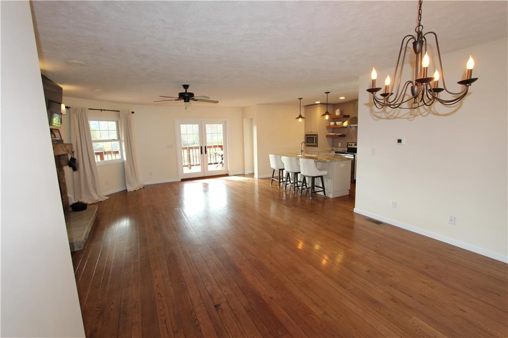 169 Wilpen Road Ligonier, PA 15658 - Photo 23 of 49 a view of a room with wooden floor fire place and windows