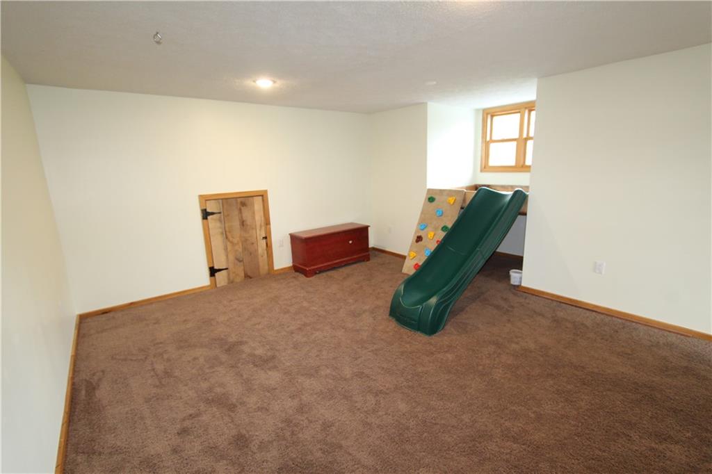 169 Wilpen Road Ligonier, PA 15658 - Photo 31 of 49 a room with a bed and a chandelier