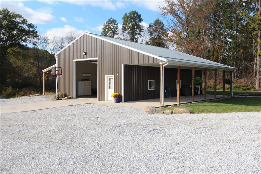 169 Wilpen Road Ligonier, PA 15658 - Photo 37 of 49 a view of a house with backyard and porch