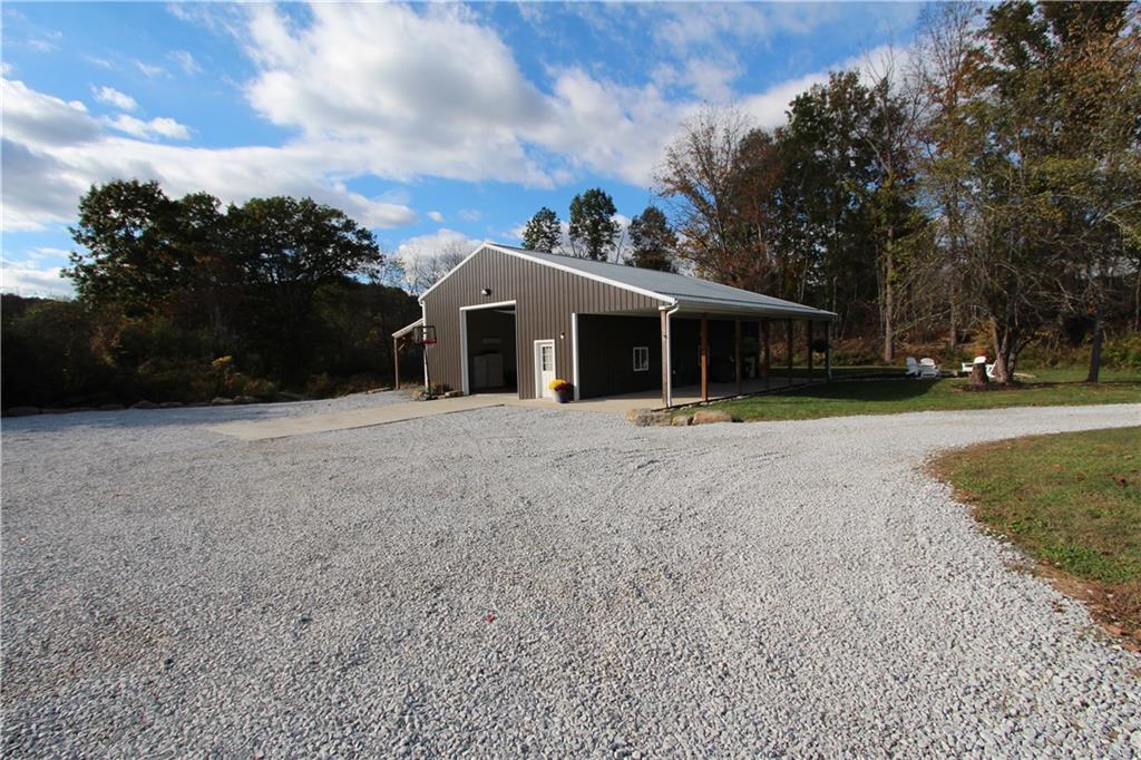 169 Wilpen Road Ligonier, PA 15658 - Photo 38 of 49 a front view of a house with a yard and trees