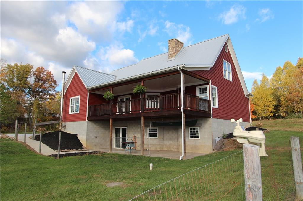 169 Wilpen Road Ligonier, PA 15658 - Photo 48 of 49 a view of a house with a yard and plants