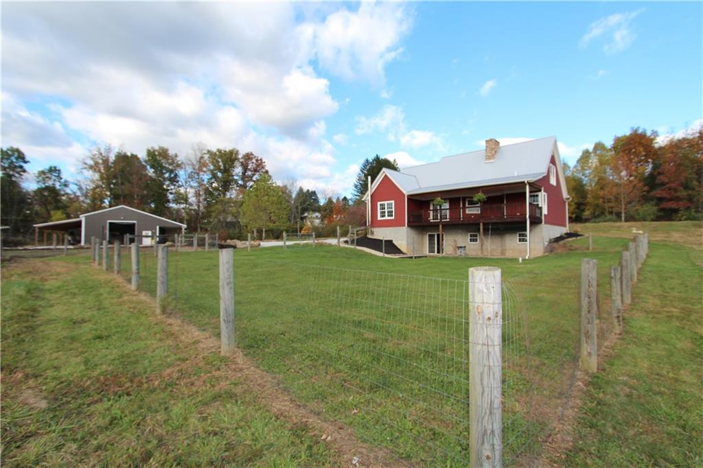 169 Wilpen Road Ligonier, PA 15658 - Photo 49 of 49 a view of a house with a big yard and sitting area