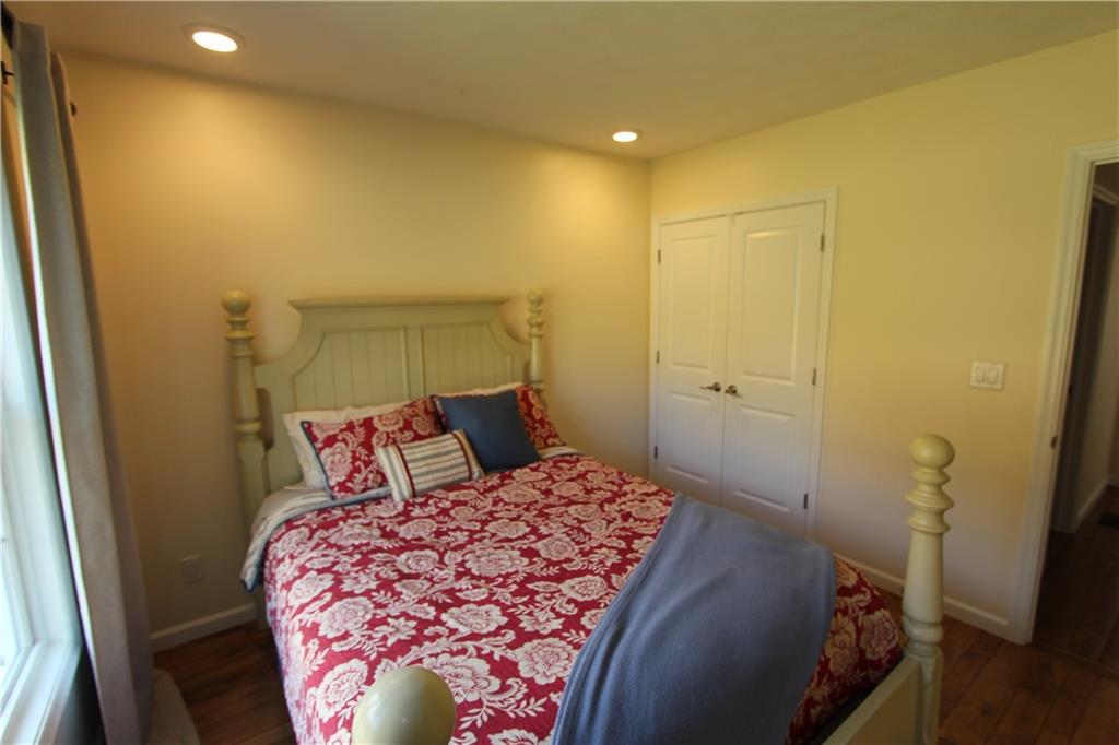 169 Wilpen Road Ligonier, PA 15658 - Photo 7 of 49 a bedroom with a bed and a mirror