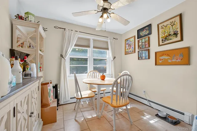 a dining room with furniture and window