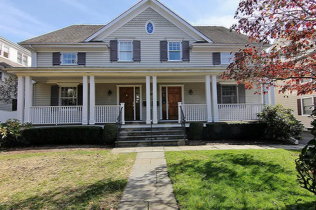 a front view of a house with a yard