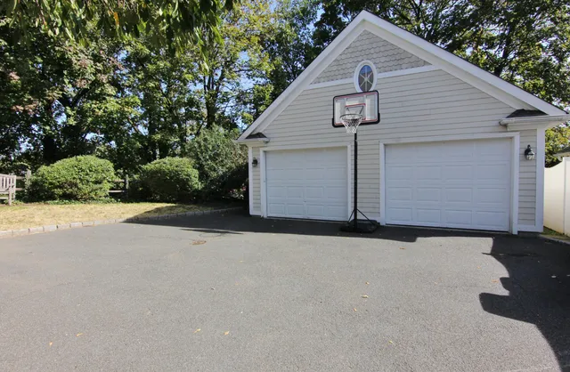 a view of garage yard and tree