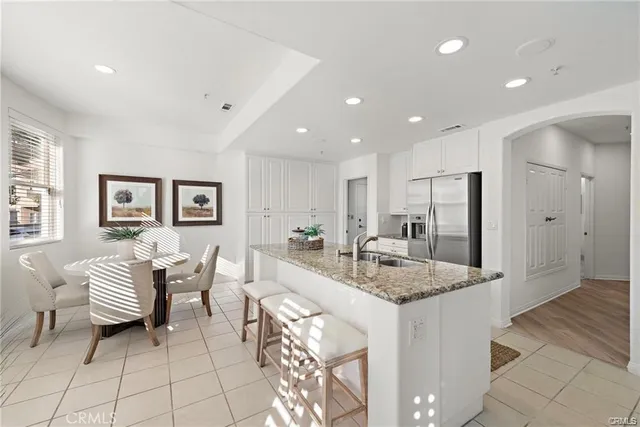 a kitchen with a dining table and chairs